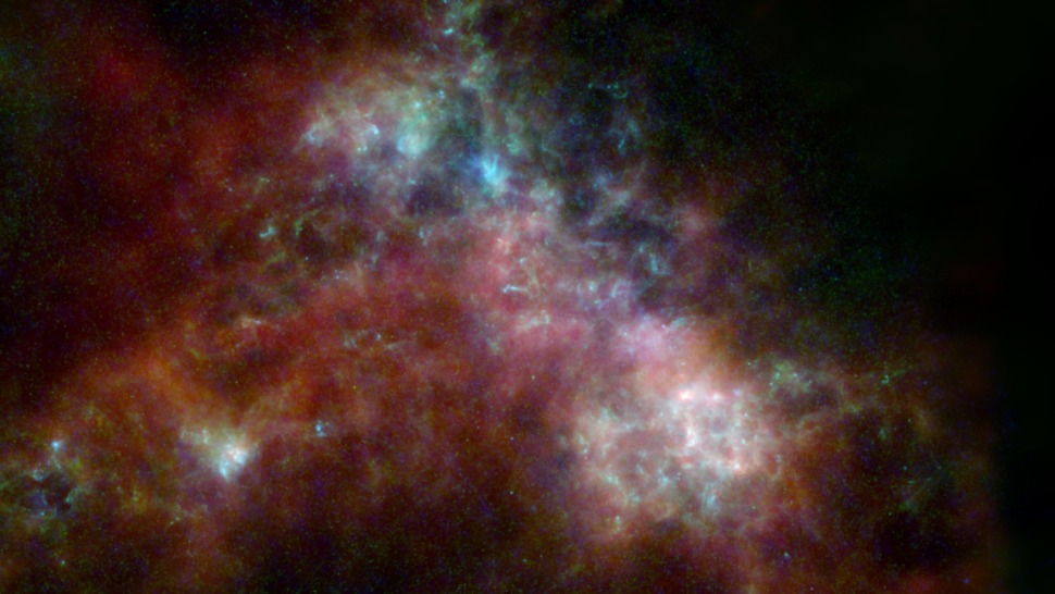 Mali Magellanov oblak, koji se nalazi u susjedstvu Mliječne staze, na ovoj slici je prikazan kakvim ga je vidjela misija Herschel uz dodatne podatke s triju drugih teleskopa (©ESA, NASA, NASA-JPL, Caltech, Christopher Clark).