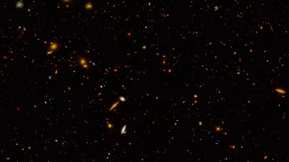 Slika snimljena u sklopu programa UVCANDELS svemirskim teleskopom Hubble prikazuje regiju udaljenu milijardama svjetlosnih godina od Zemlje koja sadrži oko 5000 galaksija (©NASA/STScI/Harry Teplitz (Caltech/IPAC)).