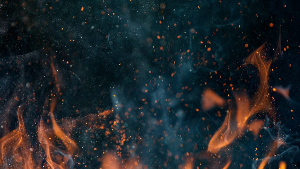 fire flames with sparks on a black background, close-up