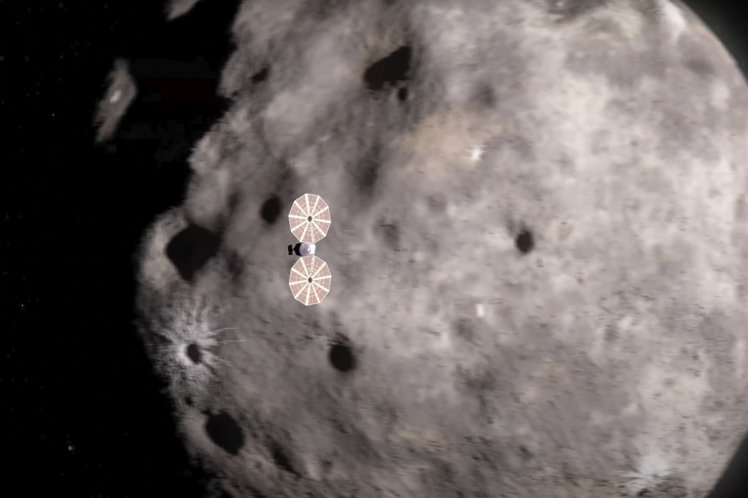 Ova ilustracija iz video animacije prikazuje letjelicu Lucy kako se približava asteroidu. Lucy je na svom dugom putovanju do Jupitera naišla na prvi od 10 asteroida. Zasluge NASA.