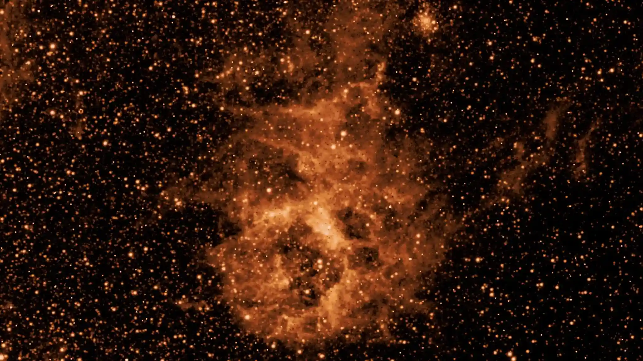 NASA-ina misija SPHEREx promatra cijelo nebo u 102 infracrvene boje, odnosno valne duljine svjetlosti koje su nevidljive ljudskom oku. Na prikazanoj snimci vidi se dio neba u valnoj duljini od 3,29 mikrona, gdje se otkriva oblak prašine sastavljen od molekula nalik čađi ili dimu. Izvor: NASA/JPL-Caltech.
