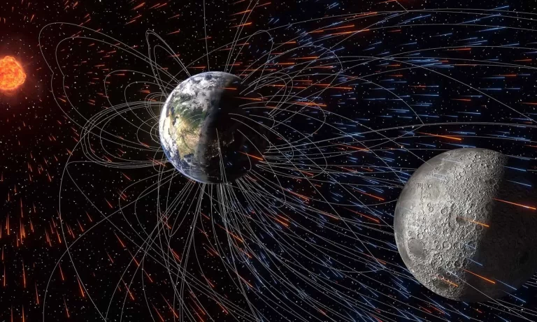 Sunčev vjetar (žuto-narančasti tragovi) izdvaja ione iz gornjih slojeva Zemljine atmosfere (svijetloplavi tragovi). Dio tih čestica kreće se duž silnica Zemljina magnetskog polja (pune bijele krivulje) i taloži se na površini Mjeseca. Taj proces može ostaviti u mjesečevu tlu zapis o sastavu Zemljine atmosfere. Izvor: ilustracija Sveučilišta Rochester / Shubhonkar Paramanick