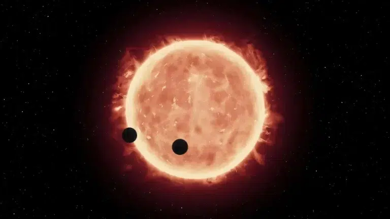 Ova umjetnička ilustracija prikazuje dva svijeta veličine Zemlje kako prolaze ispred svoje matične zvijezde, crvenog patuljka u sustavu TRAPPIST-1, udaljenom 40 svjetlosnih godina. Zasluge: ESA/Hubble
