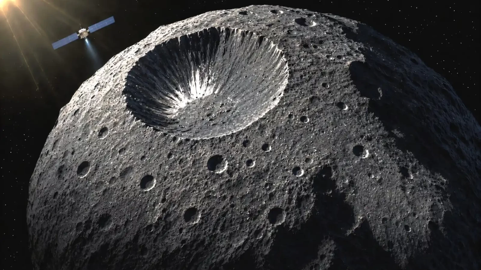 Umjetnički prikaz NASA-ine letjelice Dawn iznad kraterirane površine asteroida Veste. Credit: Institut de physique du globe de Paris
