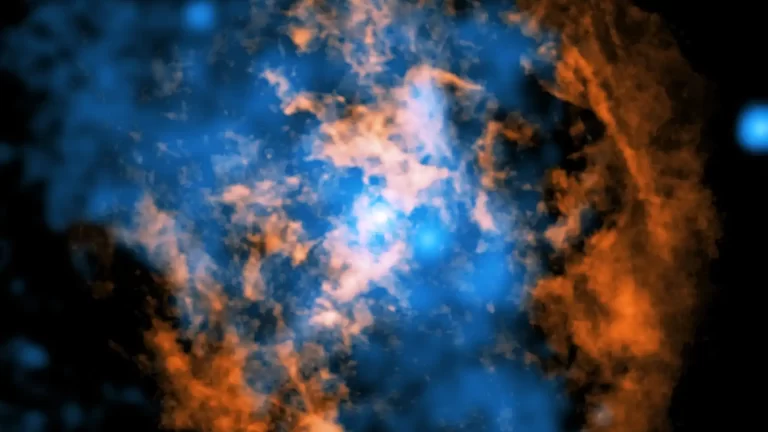 Ova kompozitna fotografija prikazuje dokaz vjetra koji se širi od Sagittarius A* (Sgr A*), supermasivne crne rupe u središtu naše galaksije. Bijela točka u središtu fotografije označava Sgr A*. Narančasto su prikazani podaci sustava radioteleskopa Atacama Large Millimeter/Submillimeter Array (ALMA) u Čileu, koji mapiraju položaj hladnog plina sastavljenog od ugljikova monoksida. Plavom bojom prikazani su rendgenski podaci NASA-inog rendgenskog opservatorija Chandra. Zasluge: Rendgenski podaci: NASA/CXC/Northwestern Univ./M. Gorski; radijski podaci: ESO/NAOJ/NRAO/ALMA; obrada: NASA/CXC/SAO/K. Arcand i P. Edmonds.