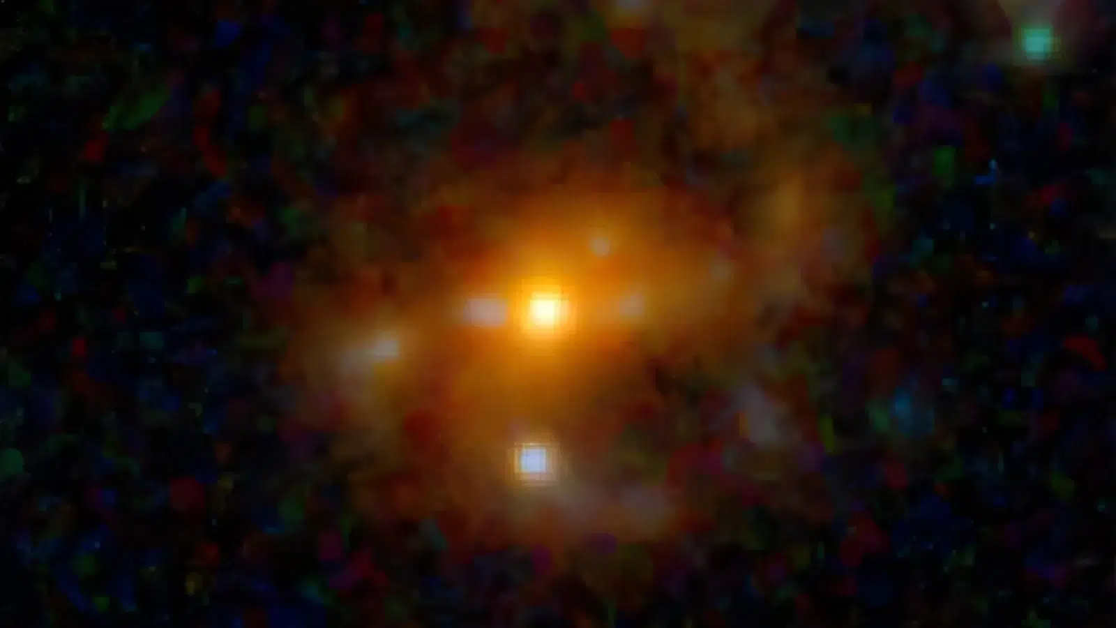 Kompozitna lažno obojena JWST snimka galaksije M1149-BSG-z5 s jarko narančastim središtem i difuznim okolnim sjajem na tamnoj pozadini.