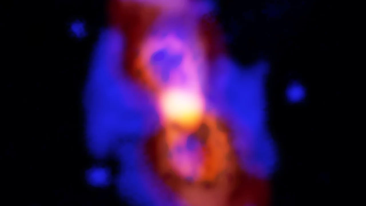 Kompozitna snimka plina i prašine oko sjajnog središta ostatka CK Vulpeculae, u plavim, crvenim i narančastim bojama